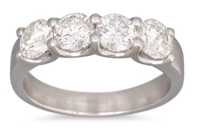 Lot 271 - A FOUR STONE DIAMOND RING, the brilliant cut...