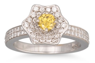 Lot 175 - A DIAMOND FLOWER CLUSTER RING, set with a...