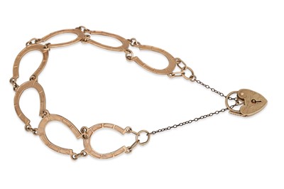 Lot 4 - A 9CT GOLD HORSESHOE LINK BRACELET, with...