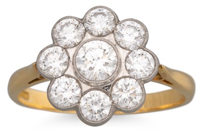Lot 282 - A DIAMOND DAISY CLUSTER RING, the brilliant...
