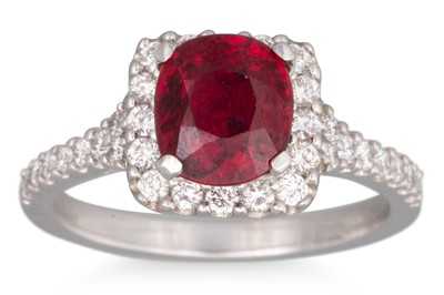 Lot 286 - A DIAMOND AND RUBY RING, the oval ruby to...