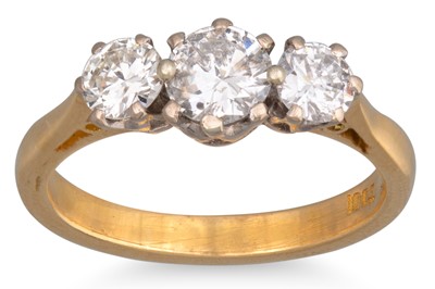 Lot 293 - A THREE STONE DIAMOND RING, the brilliant cut...