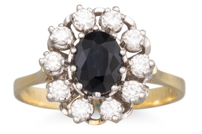 Lot 116 - A SAPPHIRE AND DIAMOND CLUSTER RING, the oval...