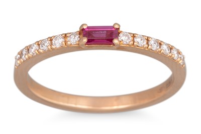 Lot 150 - A RUBY AND DIAMOND RING, the baguette cut ruby...