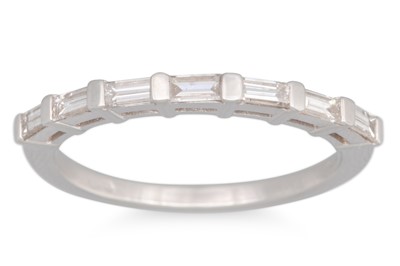 Lot 153 - A DIAMOND BAGUETTE RING, mounted in 18ct white...