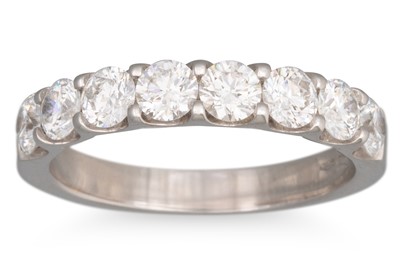 Lot 257 - A DIAMOND HALF ETERNITY RING, the brilliant...