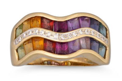 Lot 210 - A TRIPLE ROW WAVE RING, comprising blue topaz,...
