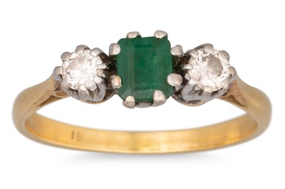 Lot 207 - AN EMERALD AND DIAMOND THREE STONE RING, to a...