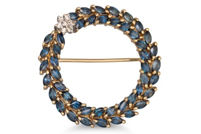 Lot 107 - A DIAMOND AND SAPPHIRE BROOCH, of circular...