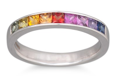 Lot 86 - A RAINBOW SAPPHIRE HALF ETERNITY RING, the...