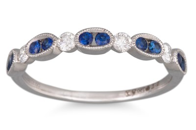Lot 120 - A DIAMOND AND SAPPHIRE SET BAND RING, the...