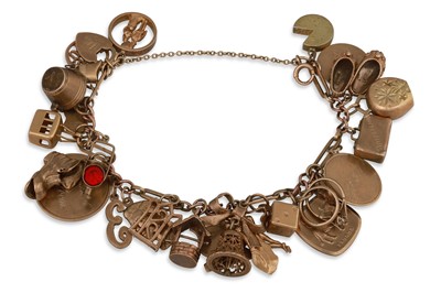 Lot 1 - A 9CT GOLD CHARM BRACELET, with 35 assorted...