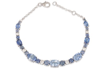 Lot 262 - A SAPPHIRE AND DIAMOND BRACELET, the oval...
