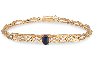 Lot 12 - A DIAMOND AND SAPPHIRE BRACELET, the oval...