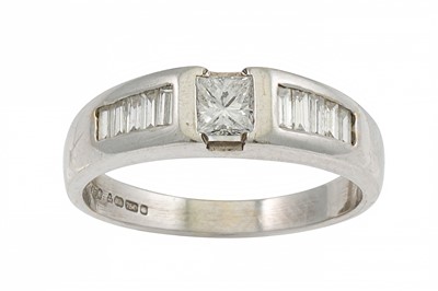 Lot 226 - A DIAMOND DRESS RING, set with Princess and...