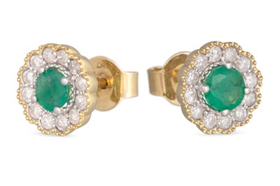 Lot 25 - A PAIR OF DIAMOND AND EMERALD EARRINGS, the...