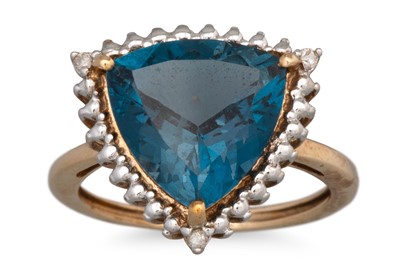 Lot 51 - A TOPAZ RING, the triangular topaz to diamond...