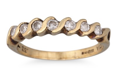 Lot 61 - A DIAMOND BAND RING, mounted in 9ct yellow...