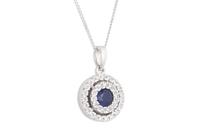 Lot 64 - A SAPPHIRE AND DIAMOND CLUSTER PENDANT, on a...