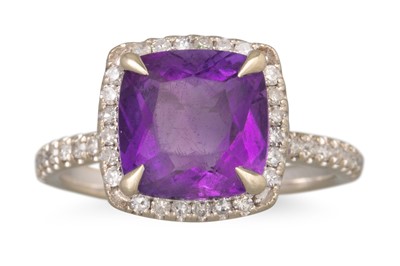 Lot 72 - AN AMETHYST AND DIAMOND CLUSTER RING, mounted...