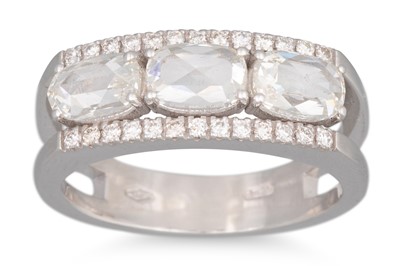 Lot 224 - A ROSE CUT DIAMOND THREE STONE RING, set with...