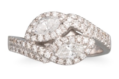 Lot 225 - A DIAMOND CROSS OVER RING, the two marquise...