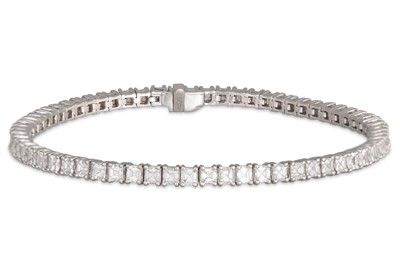 Lot 245 - A DIAMOND LINE BRACELET, ascher cut diamonds,...