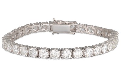 Lot 247 - AN IMPRESSIVE DIAMOND LINE BRACELET, the...