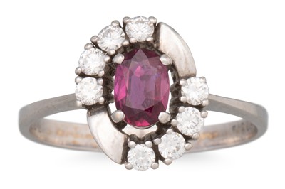 Lot 187 - A RUBY AND DIAMOND CLUSTER RING, the oval ruby...