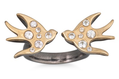 Lot 216 - A MODERN "ELLA GREEN" RING, modelled as two...