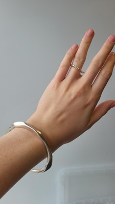 Lot 42 - AN IRISH SILVER BANGLE AND RING, by John Rocha,...