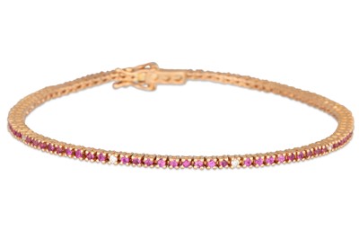Lot 104 - A RUBY AND DIAMOND BRACELET, mounted in 18ct...