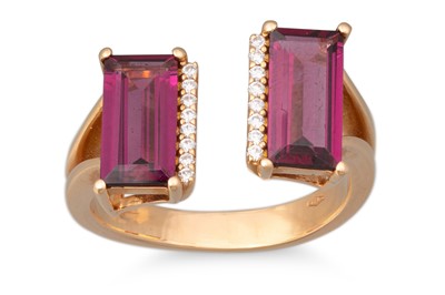 Lot 112 - A TOURMALINE AND DIAMOND CROSS-OVER RING, set...
