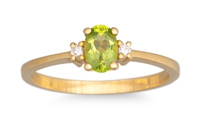Lot 114 - A PERIDOT AND DIAMOND THREE STONE RING,...