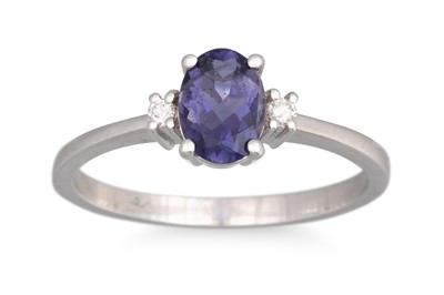 Lot 115 - AN IOLITE AND DIAMOND THREE STONE RING,...