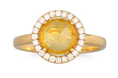 Lot 125 - A YELLOW SAPPHIRE AND DIAMOND CLUSTER RING,...