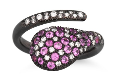 Lot 128 - A PINK SAPPHIRE AND DIAMOND RING, cross - over...