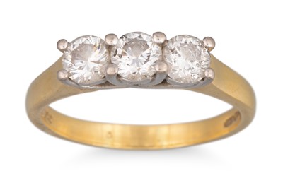 Lot 241 - A DIAMOND THREE STONE RING, mounted in 18ct...