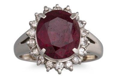 Lot 238 - A GARNET AND DIAMOND CLUSTER RING, mounted in...