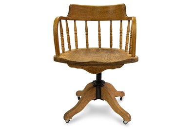Lot 447 - AN ANTIQUE EDWARDIAN OAKCAPTAIN STYLE SWIVEL...