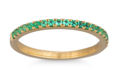 Lot 63 - AN EMERALD HALF ETERNITY RING, mounted in 18ct...