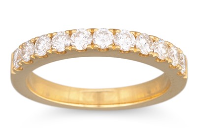 Lot 66 - A DIAMOND HALF ETERNITY RING, the brilliant...