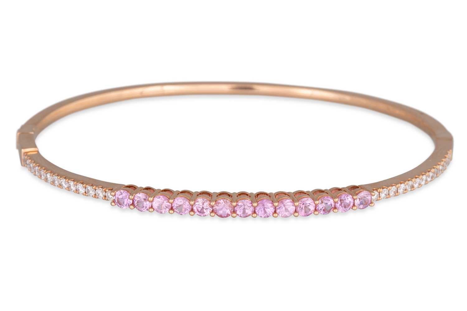 Lot 73 - A PINK SAPPHIRE AND DIAMOND SET BANGLE,...