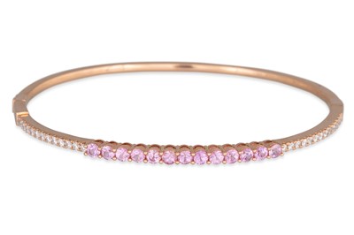Lot 73 - A PINK SAPPHIRE AND DIAMOND SET BANGLE,...