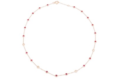Lot 74 - A RUBY AND DIAMOND SET CHAIN, the bezel set...