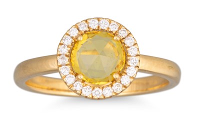 Lot 196 - A YELLOW SAPPHIRE AND DIAMOND CLUSTER RING, of...