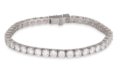 Lot 226 - A DIAMOND LINE BRACELET, the brilliant cut...