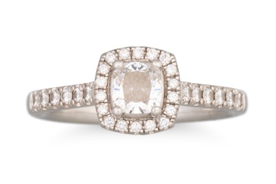 Lot 391 - A DIAMOND HALO CLUSTER RING, the central...