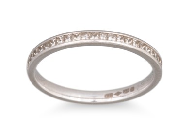 Lot 392 - A DIAMOND SET BAND RING, mounted in platinum....