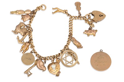 Lot 355 - A 9CT GOLD CHARM BRACELET, suspending charms...